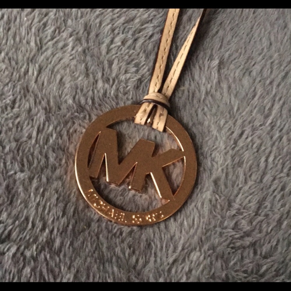 Authentic Michael Kors detachable Gold Bag Emblem